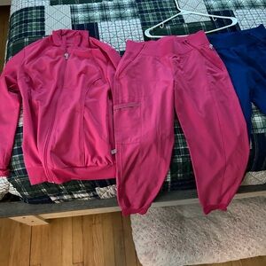Women's Pink scrub pants and scrub jacket set size small.